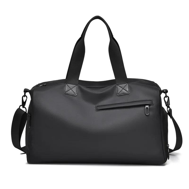Black minimalist duffel bag with top handles and shoulder strap, ideal for travel and commuting