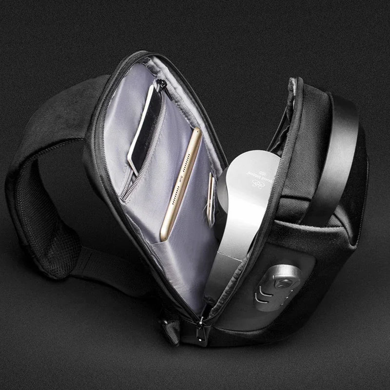 Black anti-theft commuter bag with organized interior, phone pocket, and secure zipper compartments for modern travelers