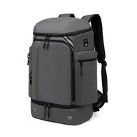 Sleek gray travel backpack with anti-theft features and vacuum compression for commuters and global travelers